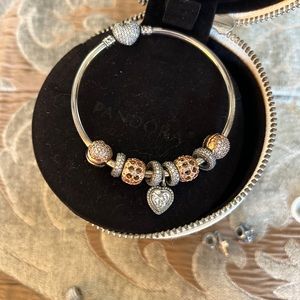 Rose gold and silver pandora bracelet.